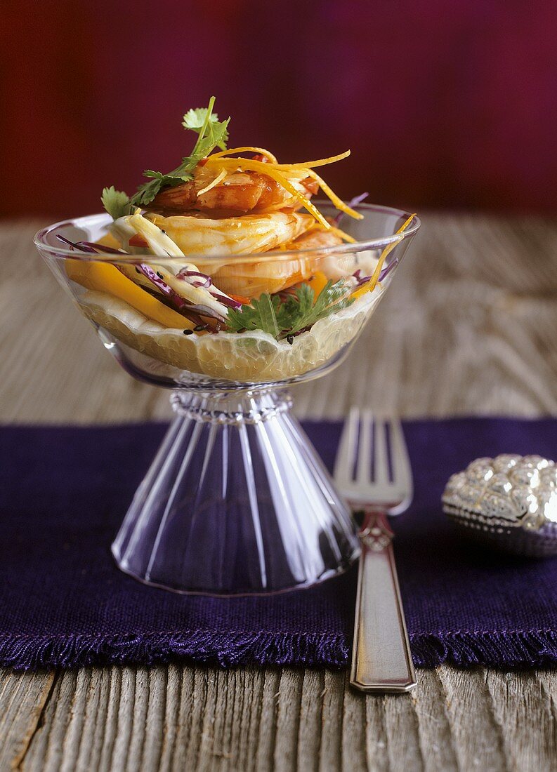 Ginger prawns on vegetable salad with grapefruit and mango