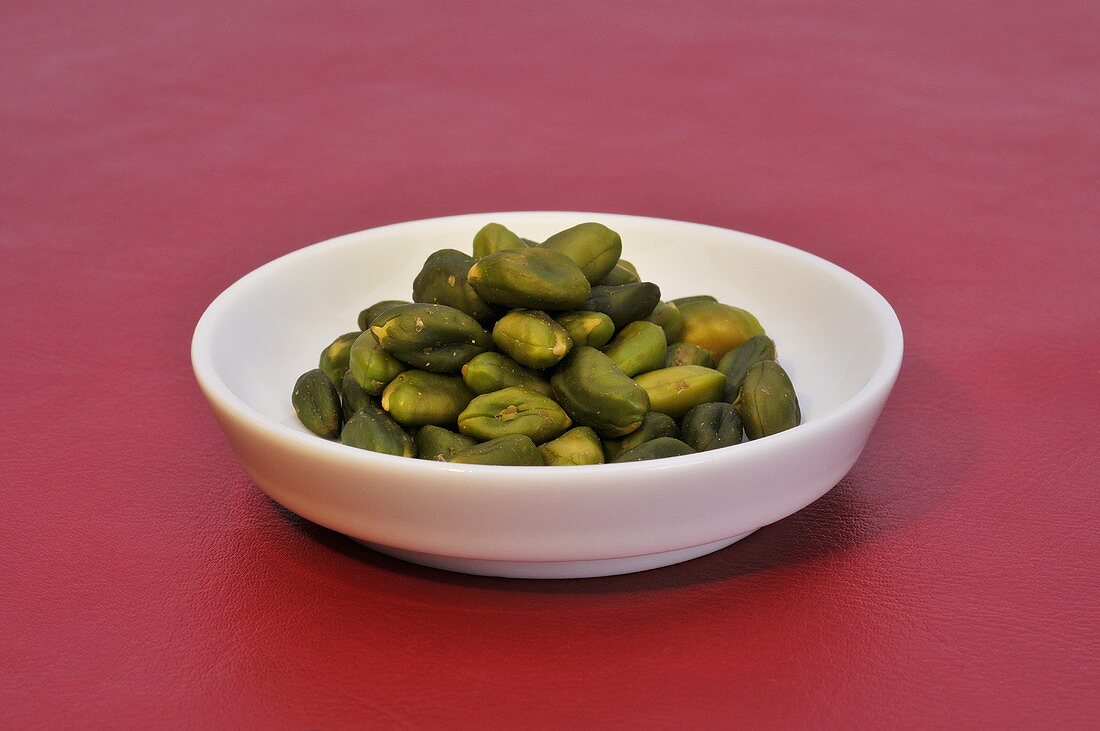 Shelled pistachios in a small dish
