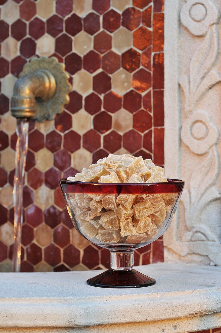 Crystallised ginger in a glass pedestal bowl