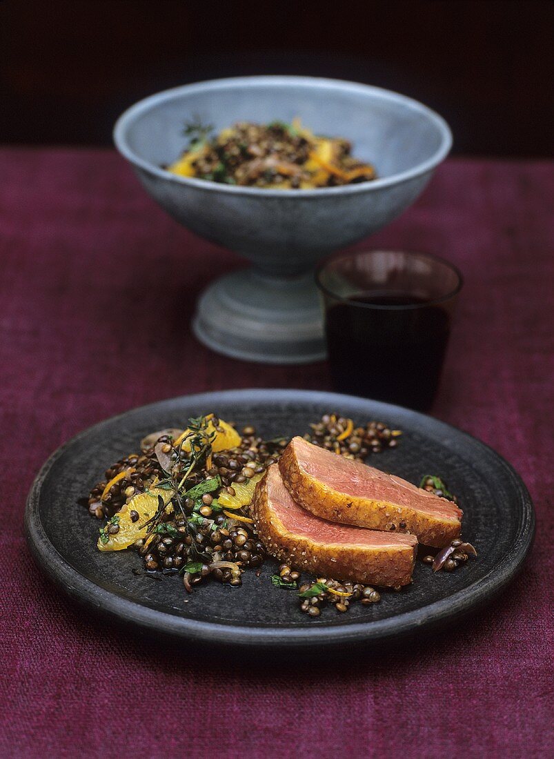 Wok-smoked goose breast on lentil salad