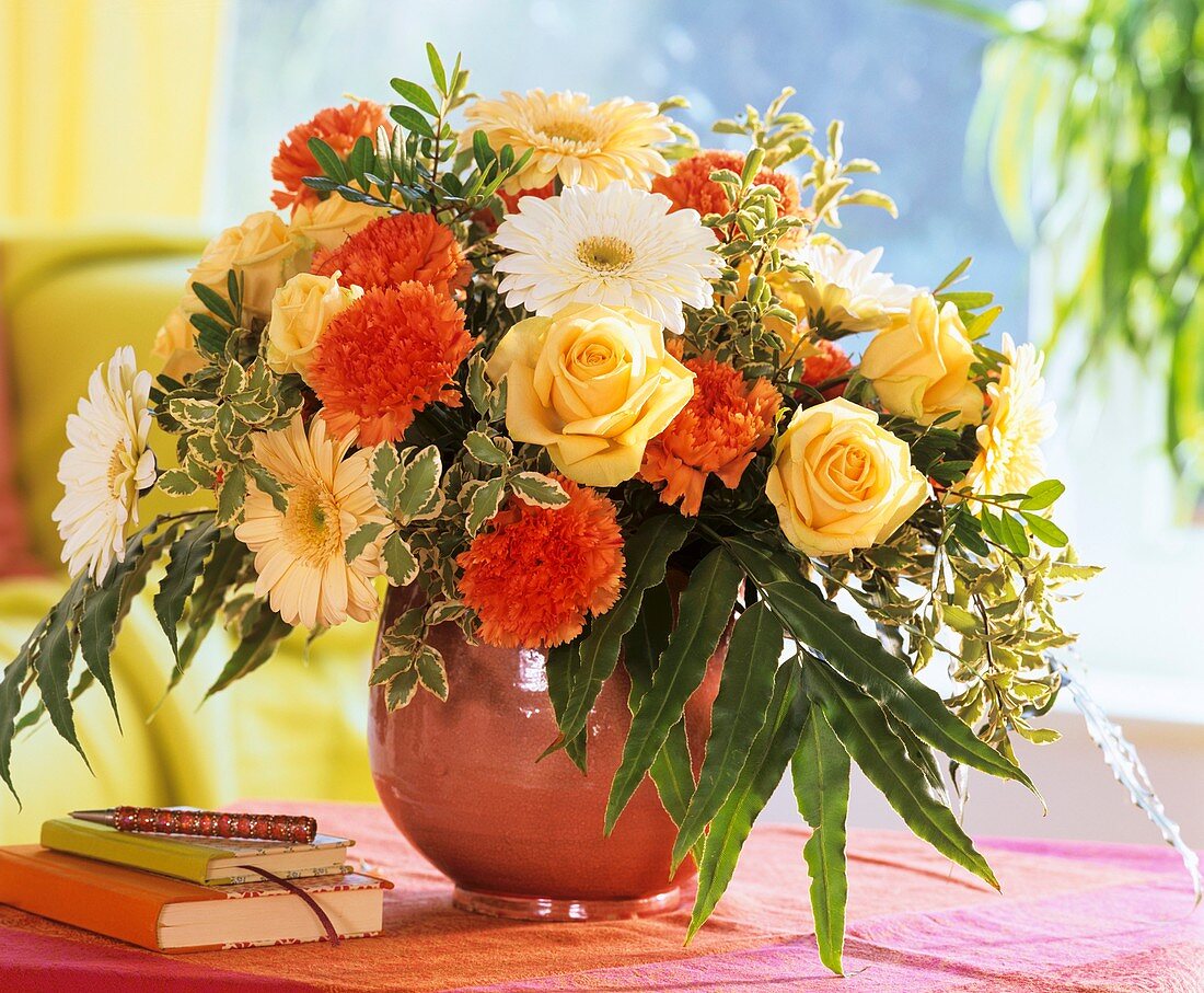 Arrangement of roses, gerberas, carnations, pittosporum etc.