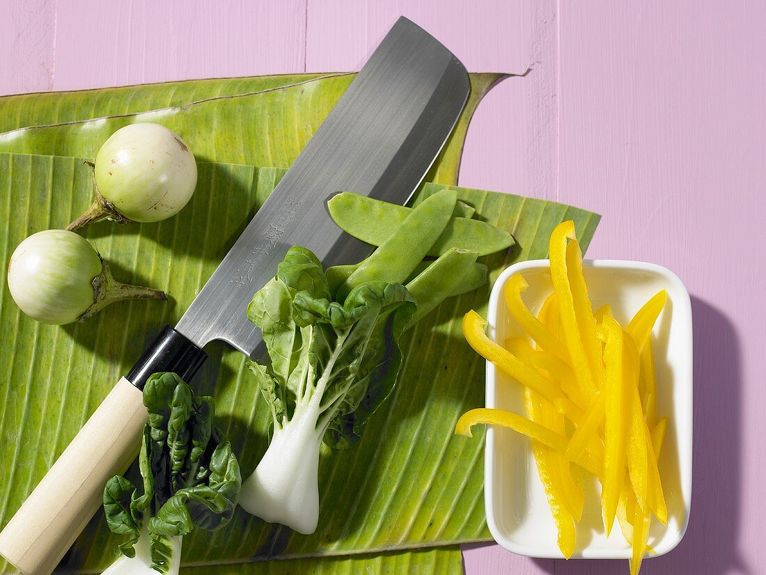 Thai aubergines, pak choi, peas and strips of pepper