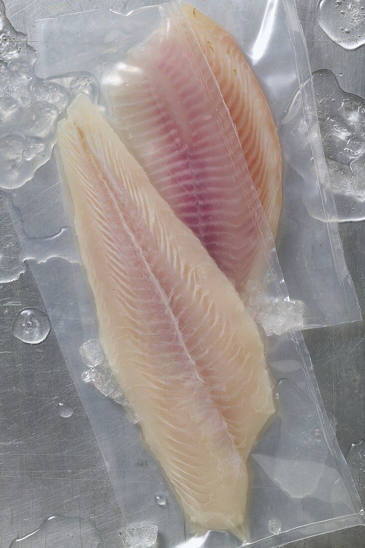 Fillet of pangasius & fillet of tilapia, both vacuum-packed