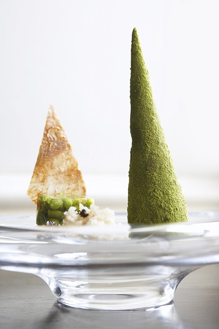Quail terrine in the shape of a spire, beans in jelly