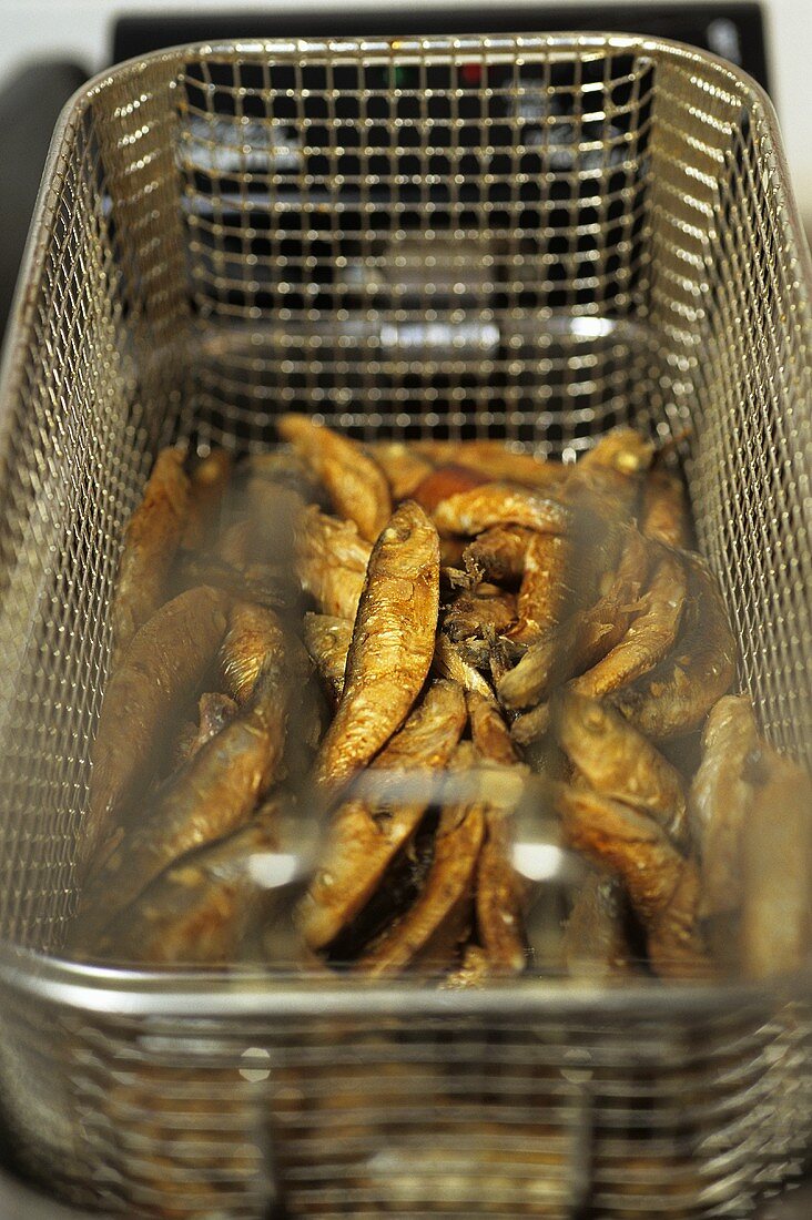 Sardines in a deep-frying basket