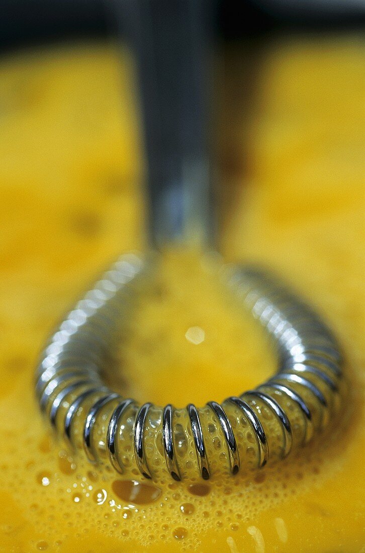 Beating egg yolks with a spiral whisk