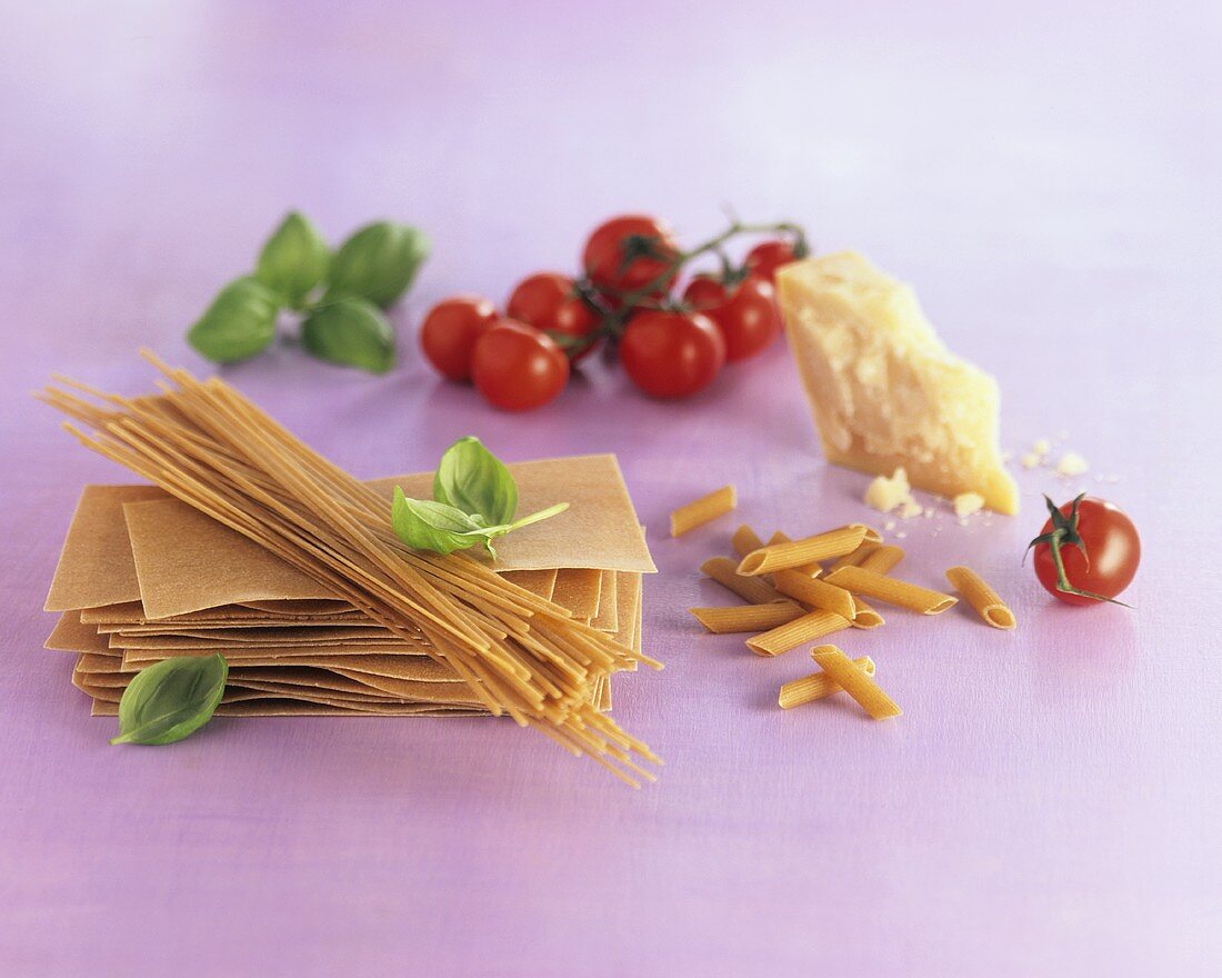 Pasta still life with basil, tomatoes and Parmesan