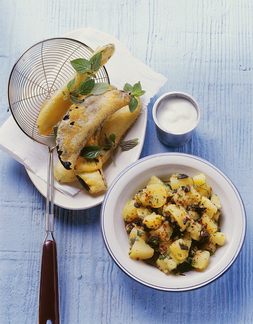Fried aubergines and courgettes, potato salad