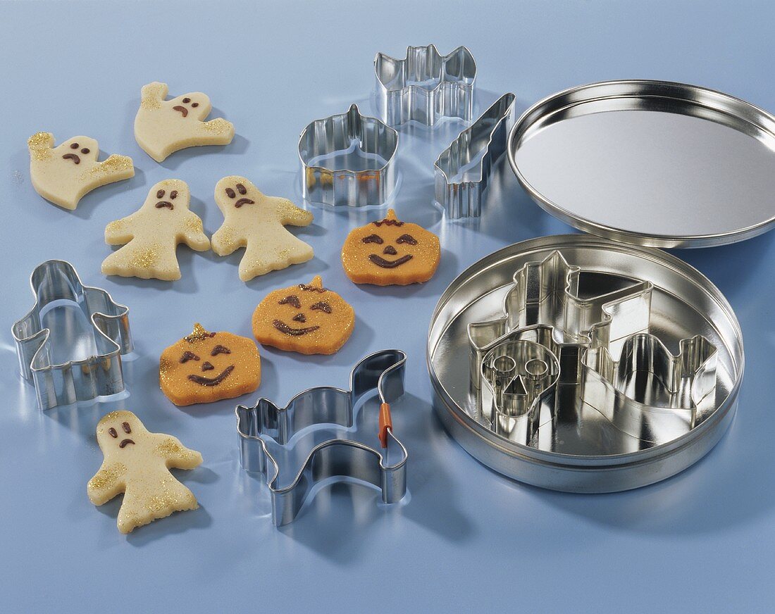 Marzipan ghosts and pumpkins with cutters for Halloween