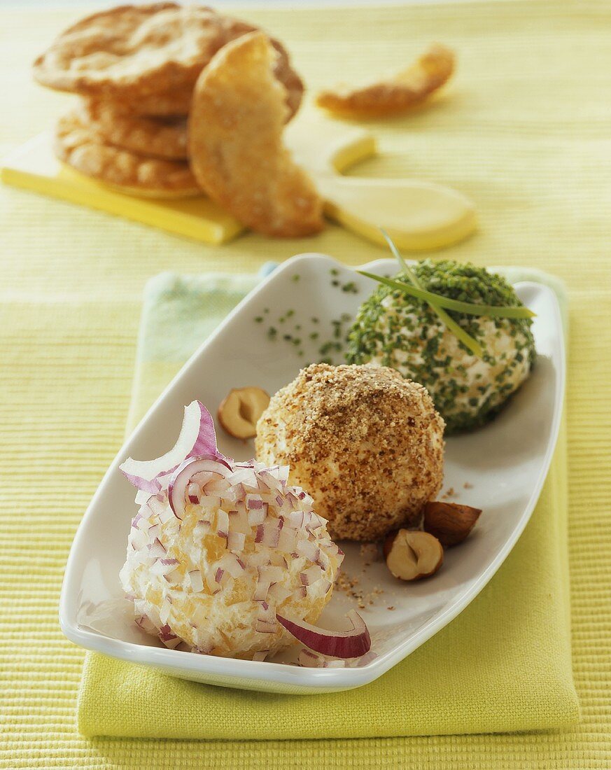 Onion, hazelnut & herb-coated cheese balls made with soft & 'hand' cheese