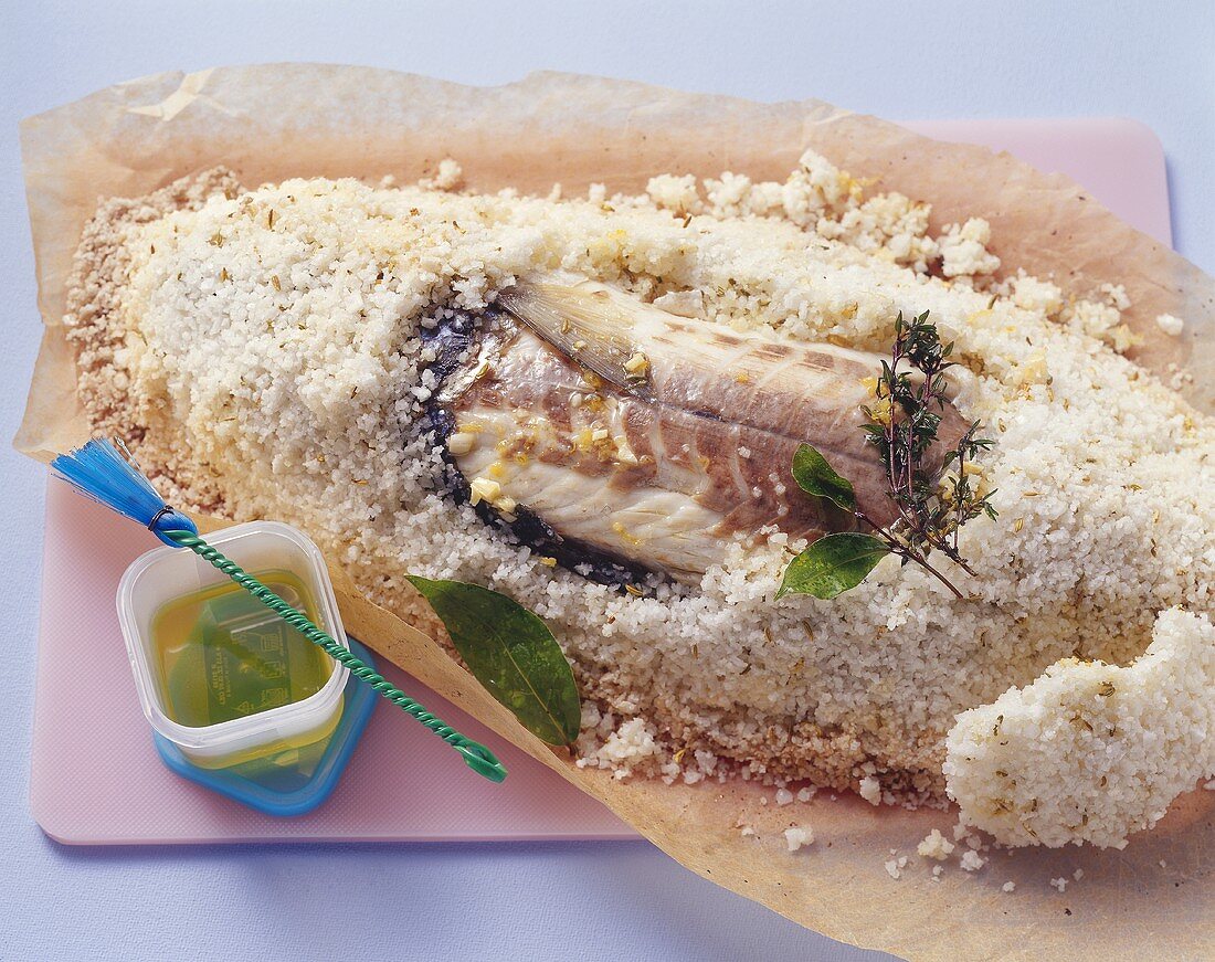 Sea bass baked in salt crust, with spiced oil