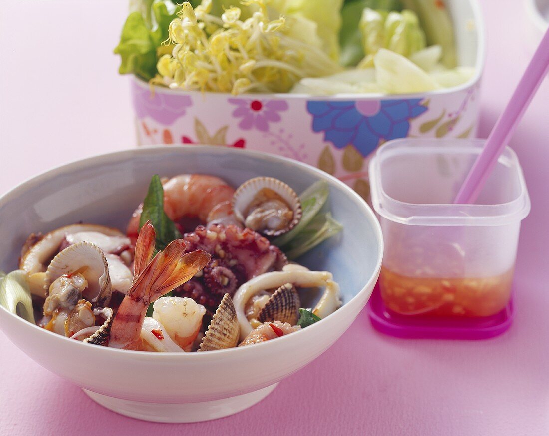 Asian seafood salad with salad leaves