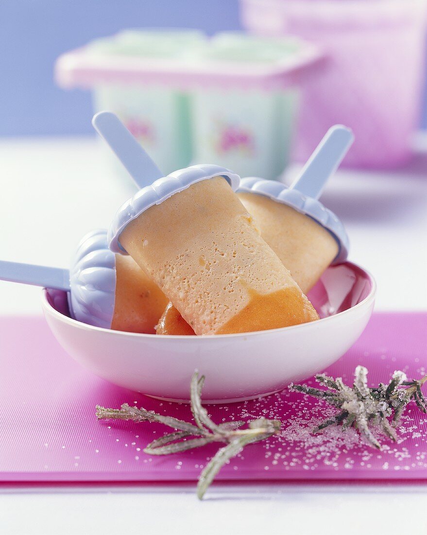 Home-made peach and rosemary ice cream lollies