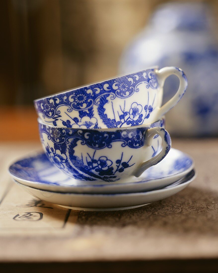 Two Chinese teacups and saucers