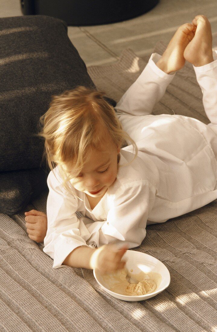 A child lying on the floor