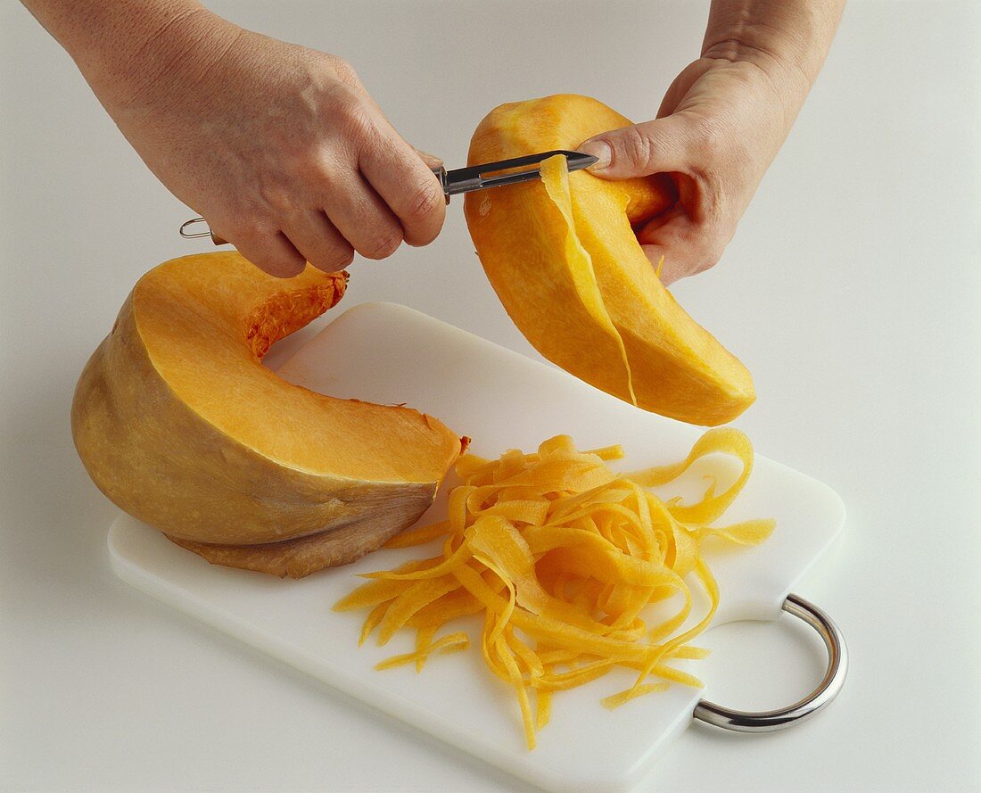 Making pumpkin ribbons with a vegetable peeler