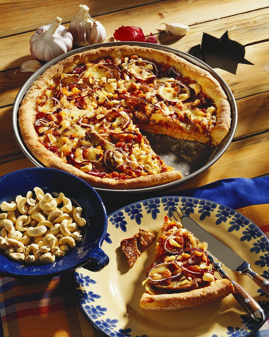 American cowboy pizza topped with beef fillet & baked beans