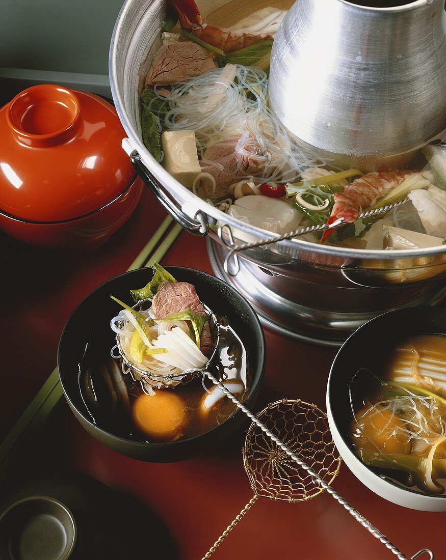 Hot pot with fish, meat, tofu and vegetables (Asia)