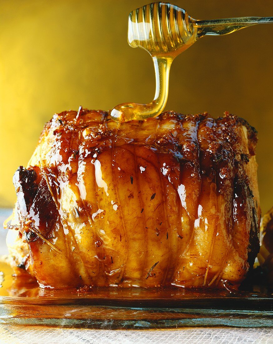 Honey running onto roast pork