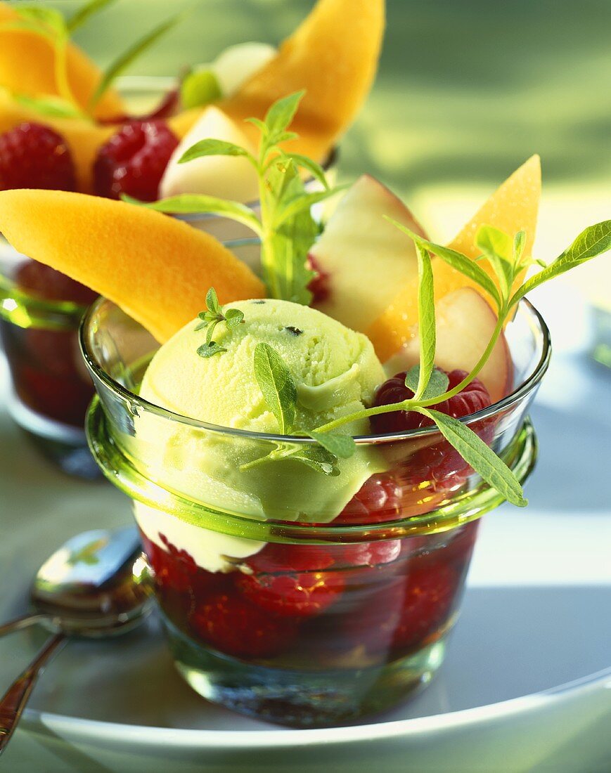 Herb sorbet on fruit in glasses