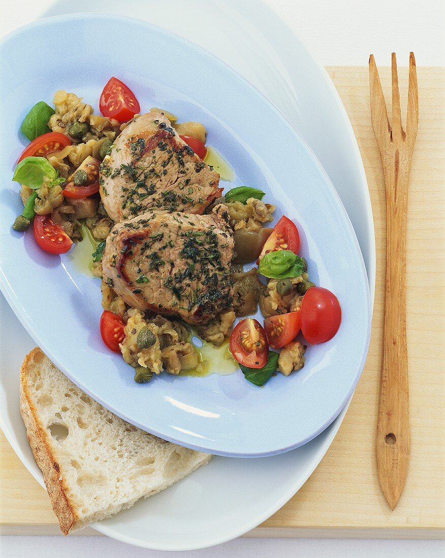 Medallions of veal with aubergine and tomato salad