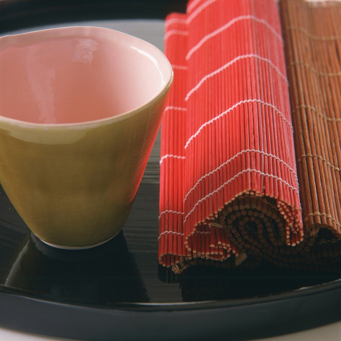 Raffia mats and beaker on tray