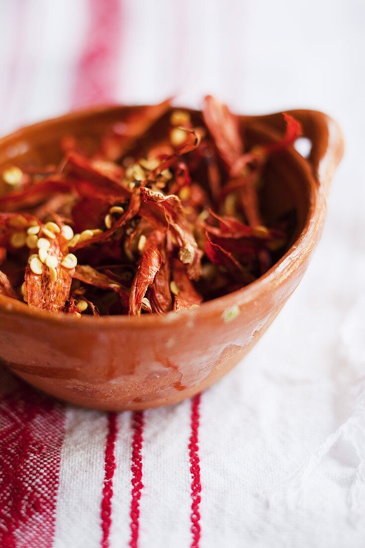 Dried chili peppers in a ceramic bowl