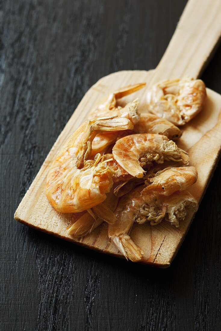 Dried shrimps on a wooden board