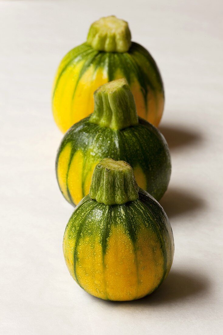 Three round courgettes