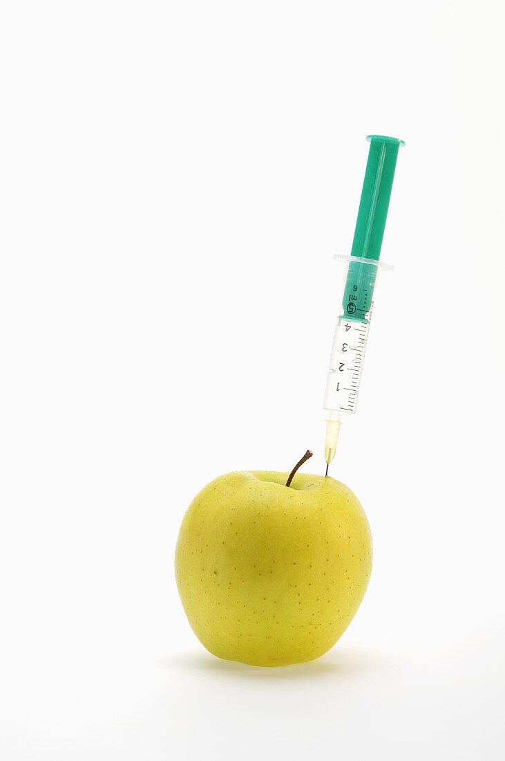 An apple and a syringe