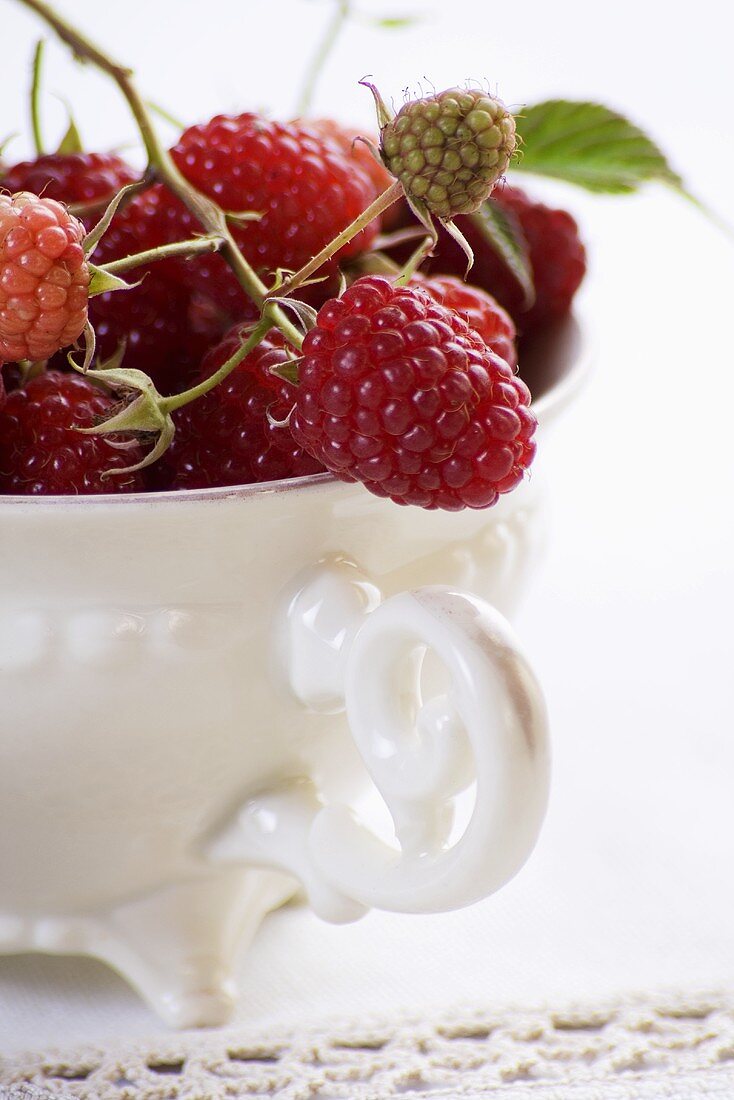 Fresh raspberries in a porcelain cup (close up)
