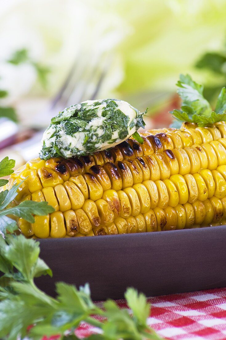 Grilled corn on the cob with herb butter