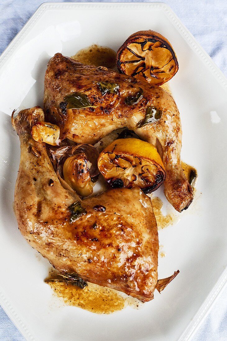 Chicken legs with lemon and basil, seen from above