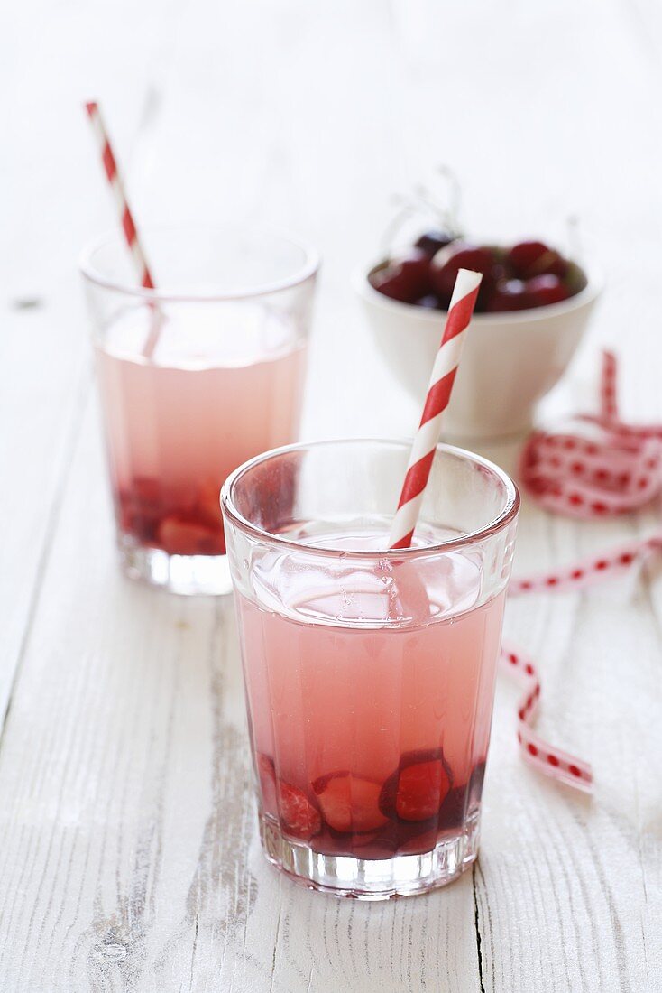 Cherryade in glasses with straws