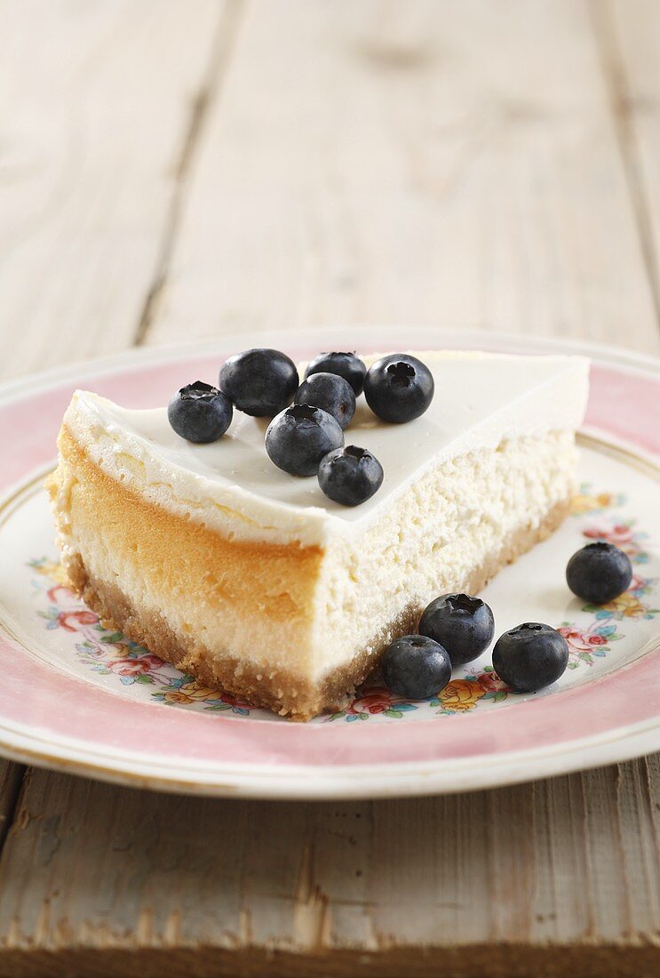 A slice of ricotta cake with blueberries