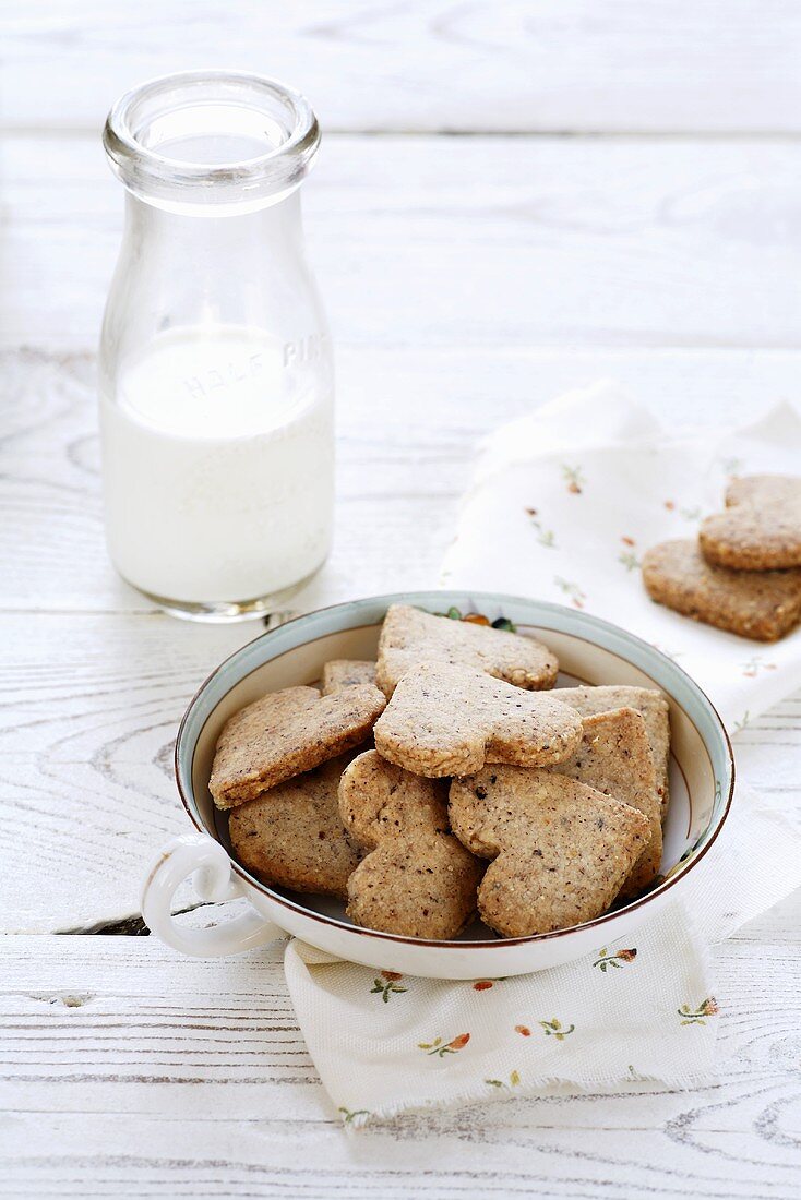 Heart-shaped nut biscuits and a bottle of milk