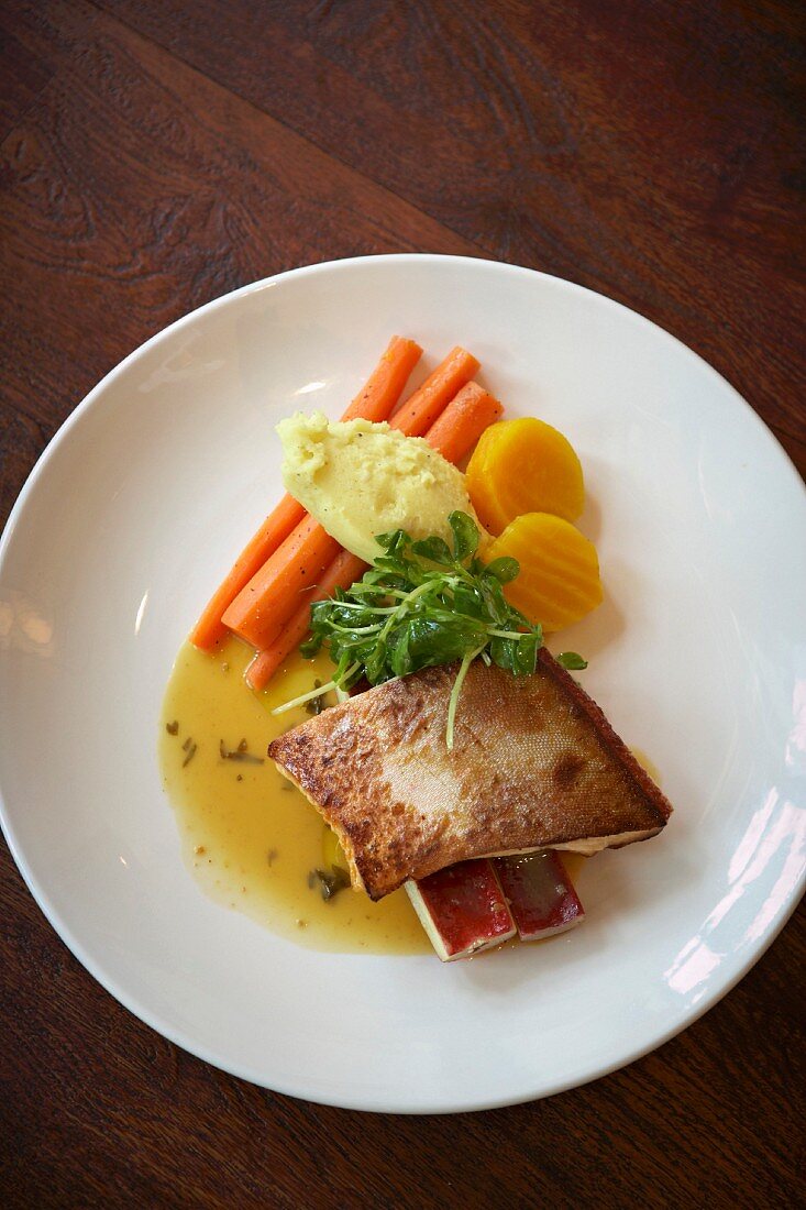 Arctic char with butter sauce and vegetables