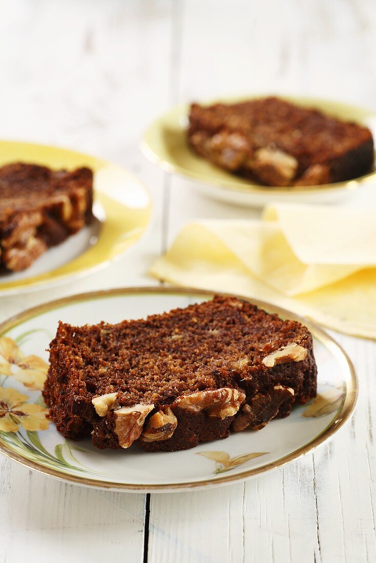 Three slices of walnut-date cake