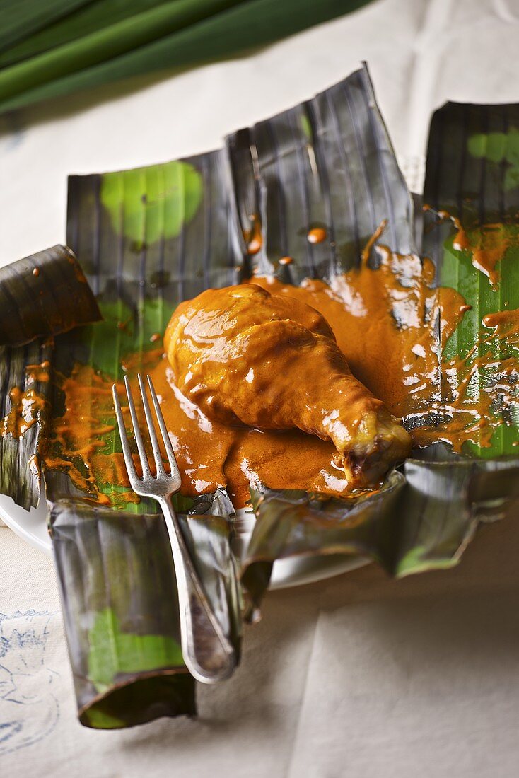 Chicken adobo on a banana leaf