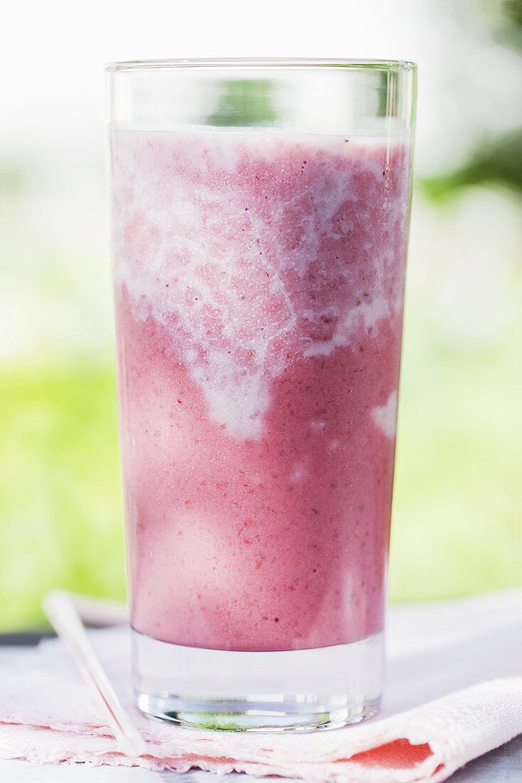 A glass of strawberry smoothie