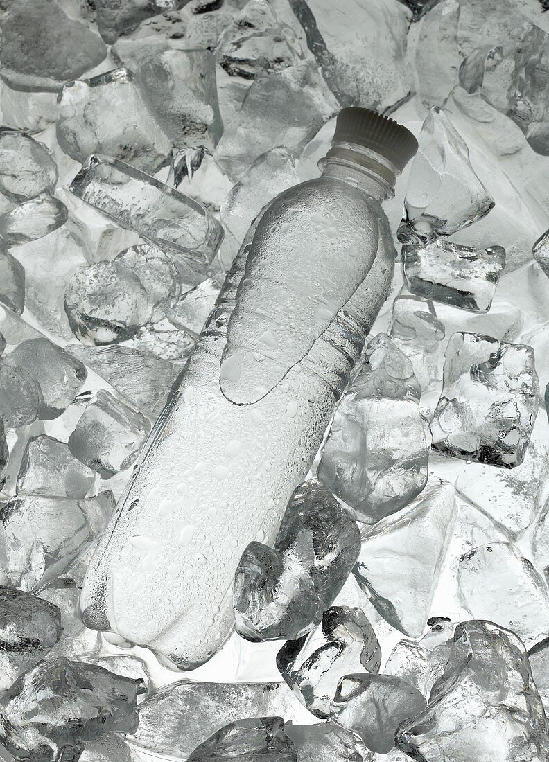 A bottle of water on ice
