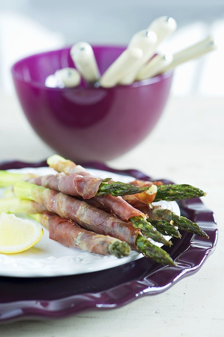 Roasted green asparagus wrapped in ham