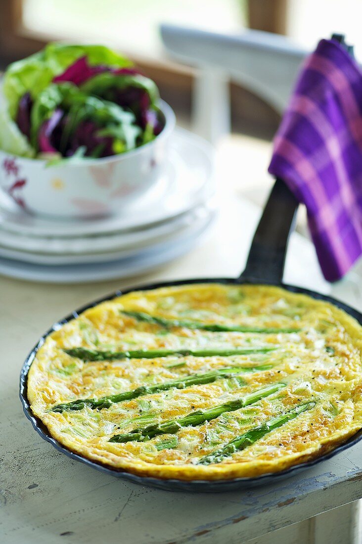 Asparagus omelette in a pan