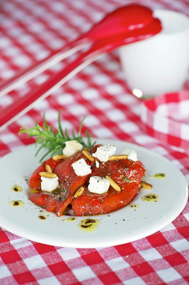 Roasted peppers with feta and pine nuts
