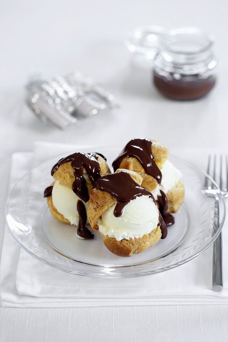 Profiteroles with ice cream and chocolate sauce for Christmas dinner