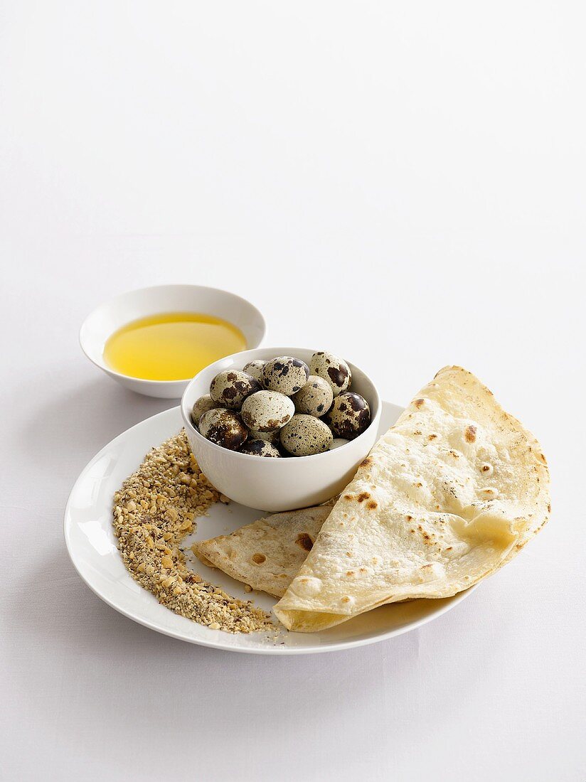 Quails eggs with dukkah and flat bread (Egypt)