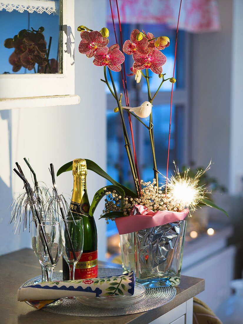 Christmas decoration with an orchid and a sparkler