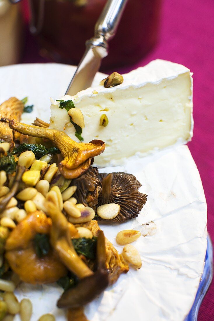 Wild mushrooms with pine nuts and Camembert