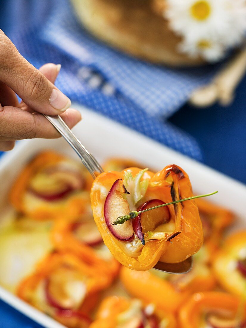 Oven baked peppers stuffed with brie and plums