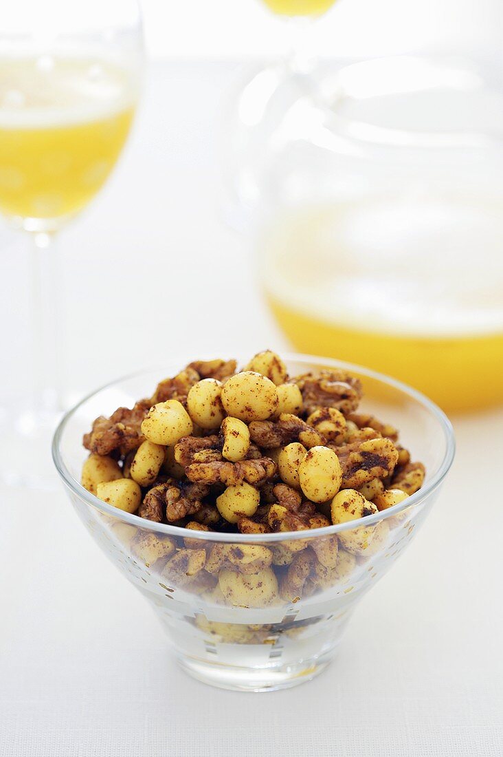 Spicy nuts in a glass bowl